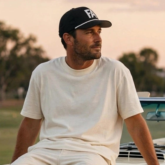 FA Free Agent hat on dude sitting on old school Benz droptop